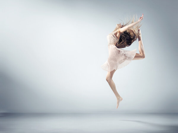 Flexible young woman in ballet figure