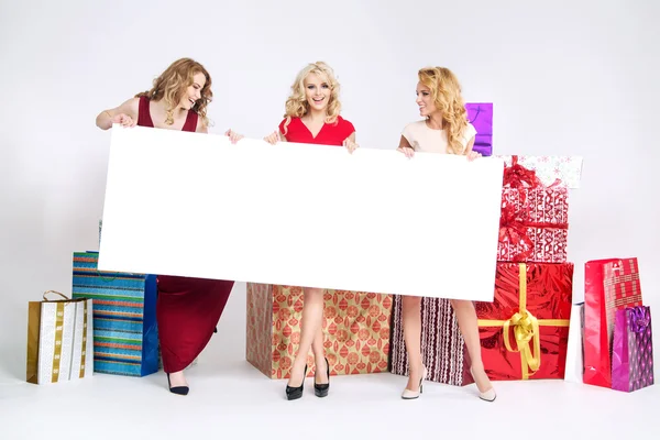 Beautiful women holding white board — Stock Photo, Image