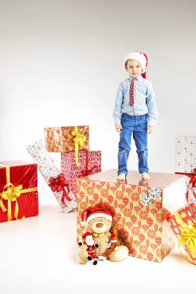 Little santa  standing on the gift — Stock Photo, Image