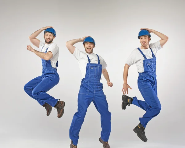 Portrait of three dancing builders — Stock Photo, Image