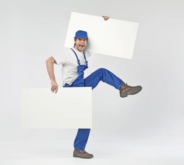 Funny photo of a builder with boards — Stock Photo, Image