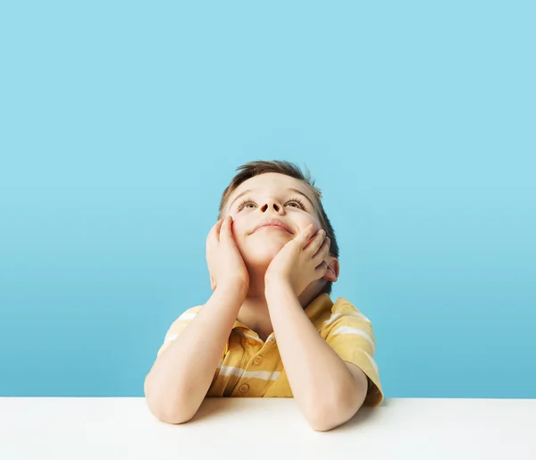 Thoughtful small boy staring at the ceiling — Stock Photo, Image