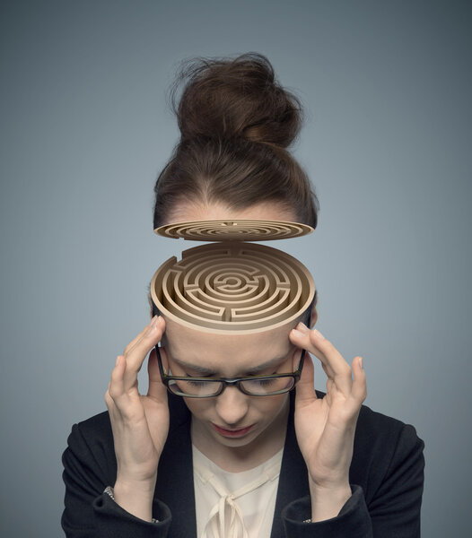 Conceptual image of a maze in the woman's brain