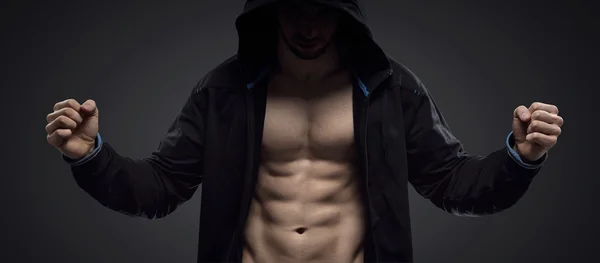 Portrait of a hooded muscular athlete — Stock Photo, Image