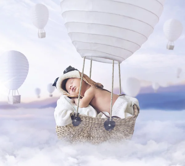 Fantasty image of little boy flying a balloon — Stock Photo, Image