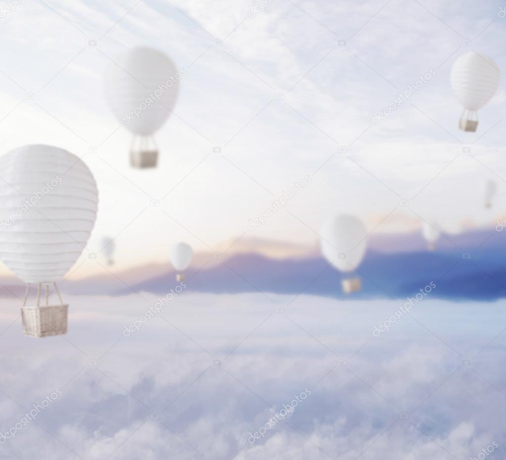 Defocused balloons over dreamy sky