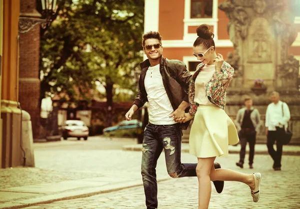 Young couple running in the middle of the day Stock Picture