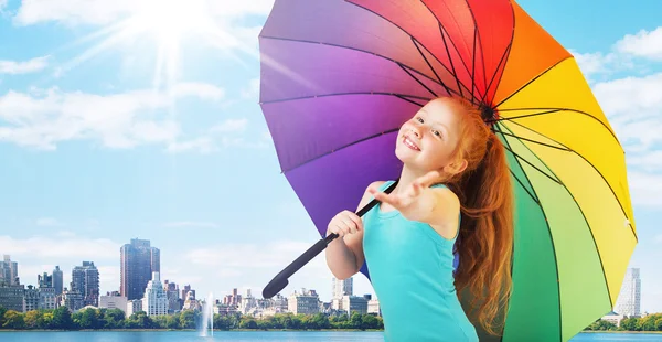 Redhead girl with an umbrella — Stock Photo, Image