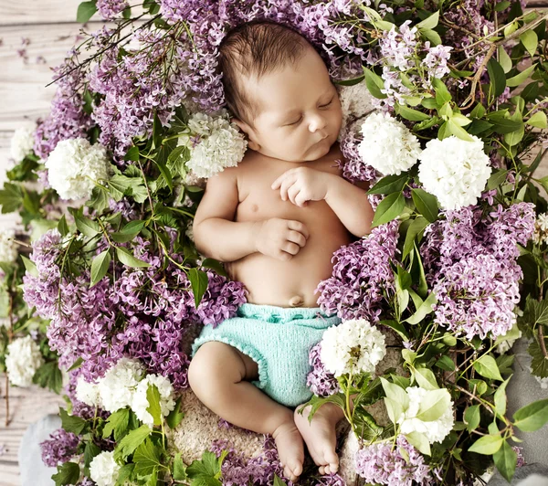 Cute child sleeping on the chaplet — Stock Photo, Image