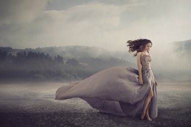 Sensual woman walking on the fantasy ground clipart