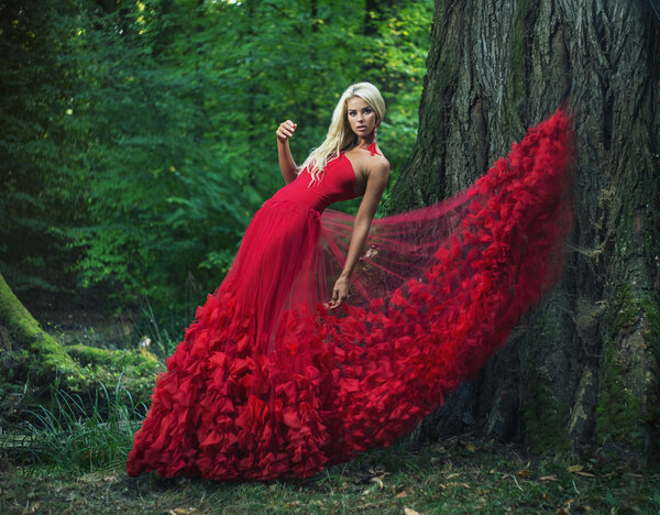 Beautiful woman wearing an amazing red dress