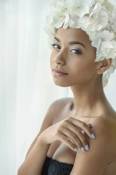 Pretty young lady with a flower hat — Stock Photo, Image
