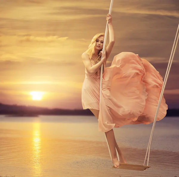 Slim lady standing on the seesaw — Stock Photo, Image