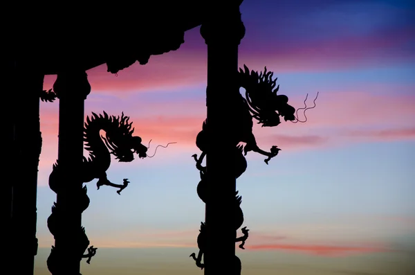 Dragon statue silhouette with nice twilight sky