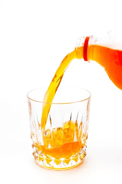 Pouring orange juice into the glass isolated — Stock Photo, Image