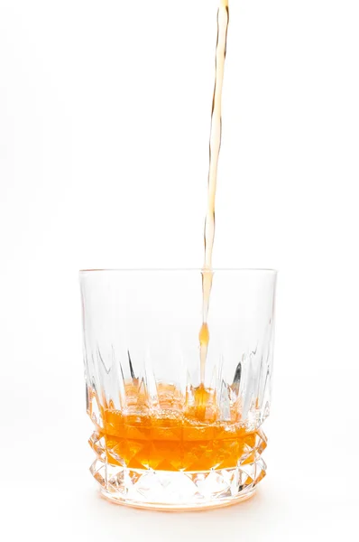 Jus d'orange in de geïsoleerd glas — Stockfoto