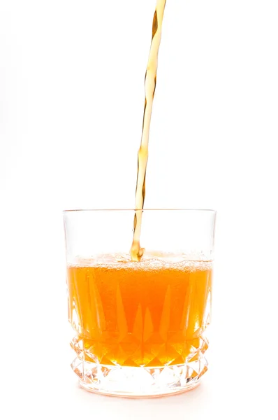 Jus d'orange in de geïsoleerd glas — Stockfoto