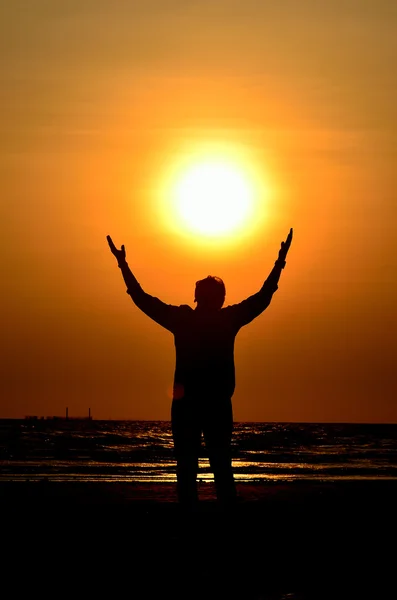 stock image Silhouette man hold the sun 