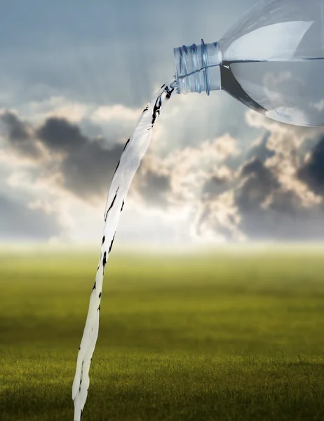 Pouring water against the nature background — Stock Photo, Image
