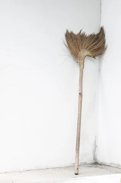 Broom beside wall — Stock Photo, Image