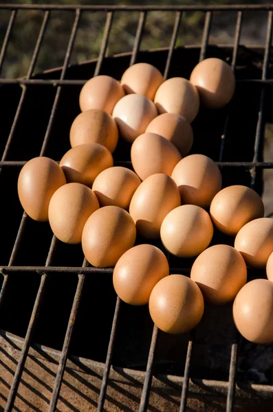 Roasting eggs on grill — Stock Photo, Image