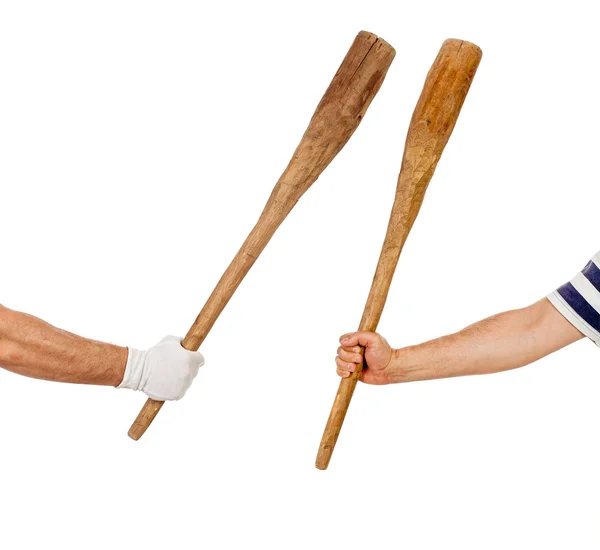 Two hands holding bats — Stock Photo, Image