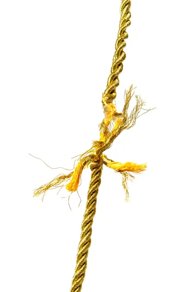 Разорванная золотая веревка на белом — стоковое фото