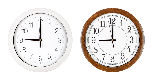 Two clock faces showing nine o'clock — Stock Photo, Image