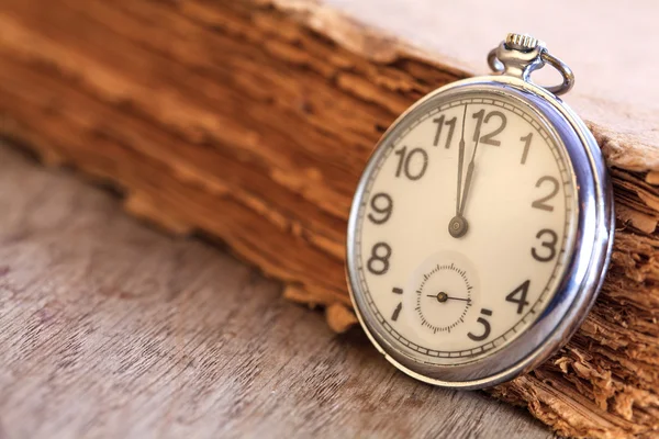 Pocket watch next to book — Stock Photo, Image