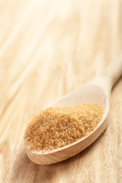 Brown sugar in a spoon — Stock Photo, Image