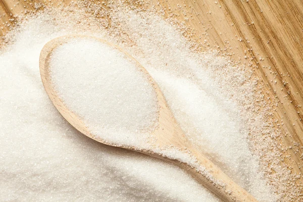 Spoon in a pile of sugar — Stock Photo, Image