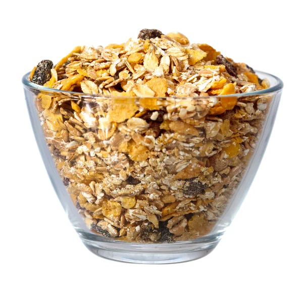 Muesli em tigela de vidro sobre branco — Fotografia de Stock