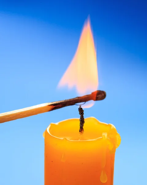 Matchstick burning candle closeup — Stock Photo, Image