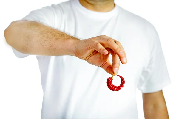 Man holding red hot chili pepper — Stock Photo, Image