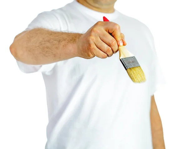 Paint brush in hand — Stock Photo, Image