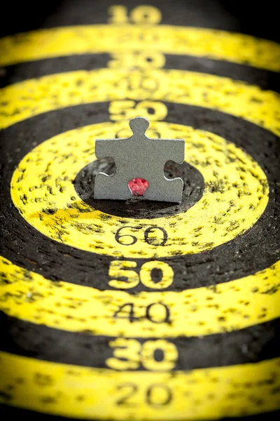 Jigsaw Puzzle Piece on Old Target — Stock Photo, Image
