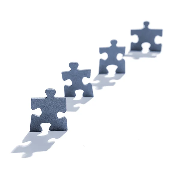 Jigsaw Puzzle Pieces in Shape of People — Stock Photo, Image