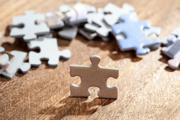 Closeup of Jigsaw Puzzle Piece on a Table — Stock Photo, Image