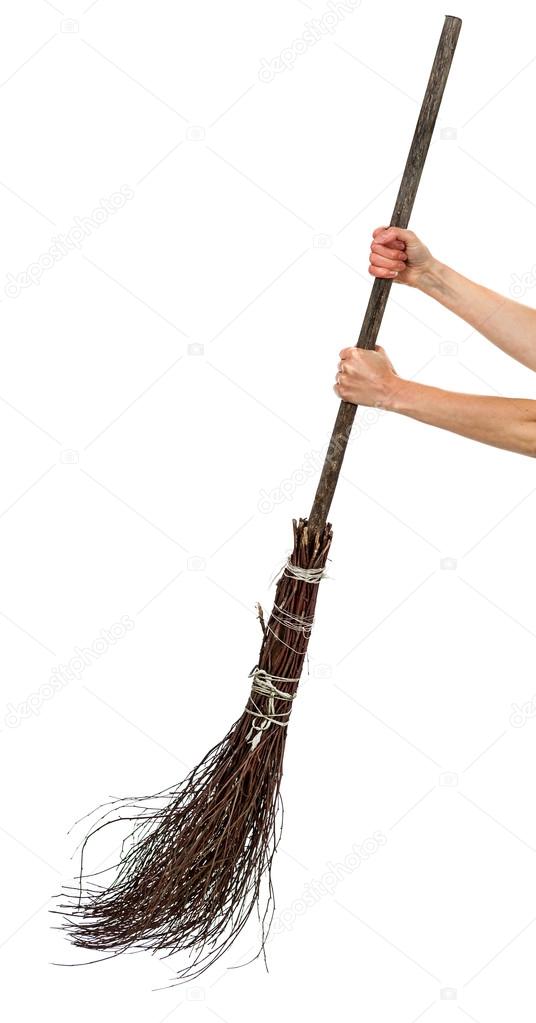 Two hands holding wicked broom