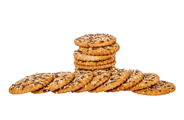 Zásobník a hromadu kulaté sušenky s sezamového a lněného semínka — Stock fotografie