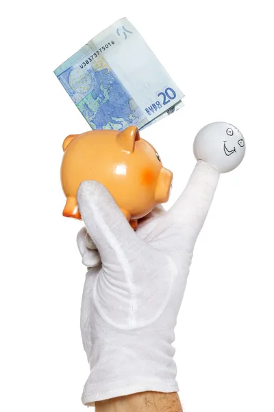 Finger puppet holding piggybank with euro note — Stock Photo, Image