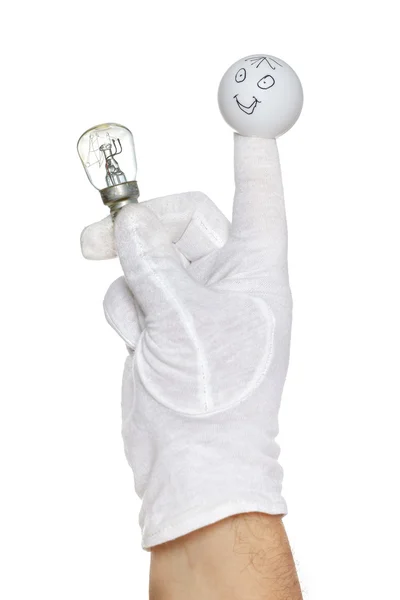 Marionnette à doigts tenant une ampoule — Photo
