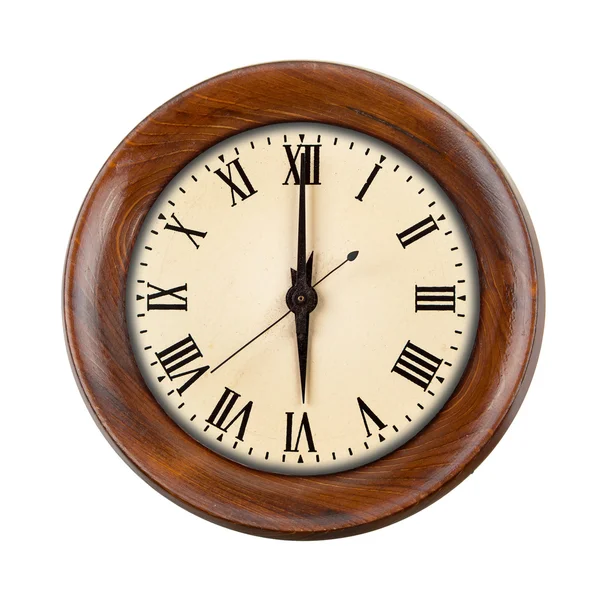 Vintage clockface showing six o'clock in wooden frame Royalty Free Stock Images