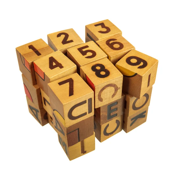 Cube made of wooden blocks with numbers and letters — Stock Photo, Image