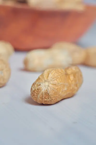 Peanuts in a brown bowl — Stock Photo, Image