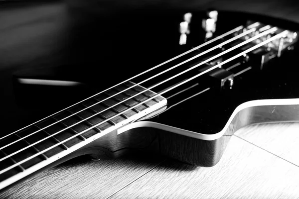 Body of a classic black bass guitar — Stock Photo, Image
