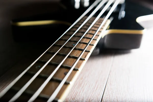 Body of a classic black bass guitar — Stock Photo, Image