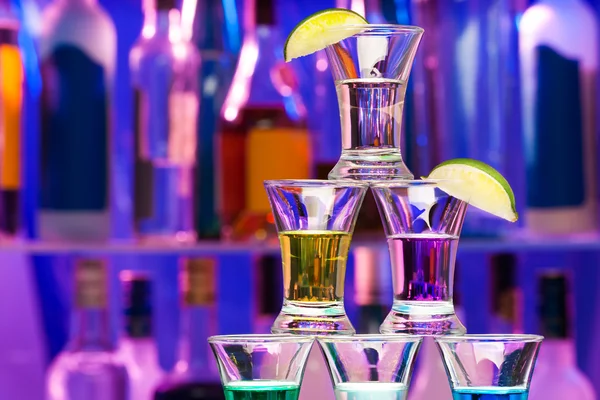 Closeup of shot pyramid  glasses with limes — Stock Photo, Image