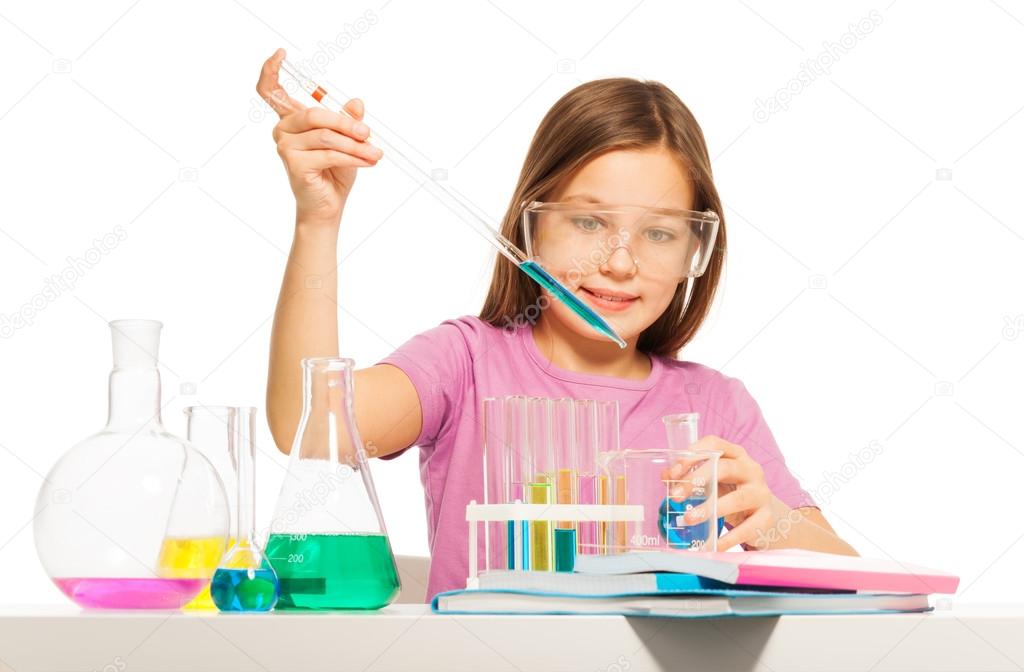 Young girl doing her chemical test in laboratory
