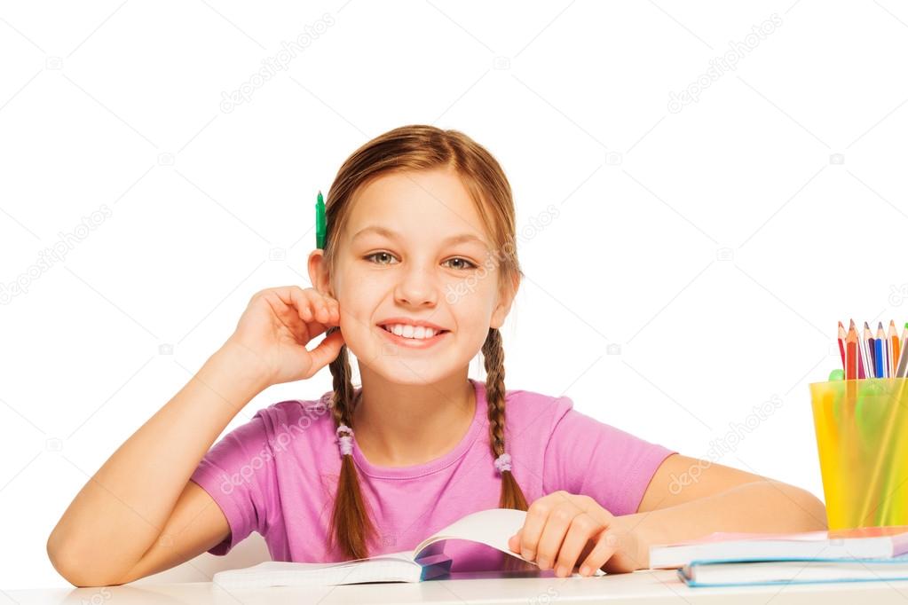 Funny schoolgirl with pencil behind her ear
